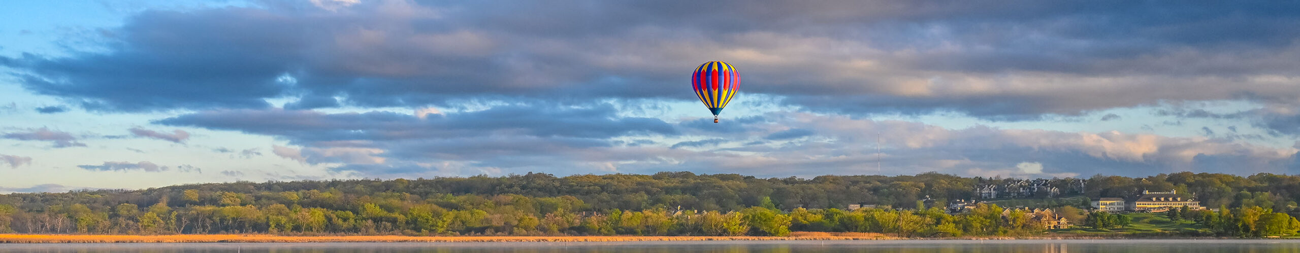 Lake Geneva landscape image featuring a red hot hair balloon. Wisconsin and Lake Geneva Area Blog